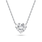 Front view of the J'ENCHANTE ONE heart-cut diamond solitaire necklace in white gold. Centered on a perfectly balanced, brilliant heart-shaped stone, the pure and minimalist design captures light effortlessly, offering a romantic and unmistakable statement of elegance.