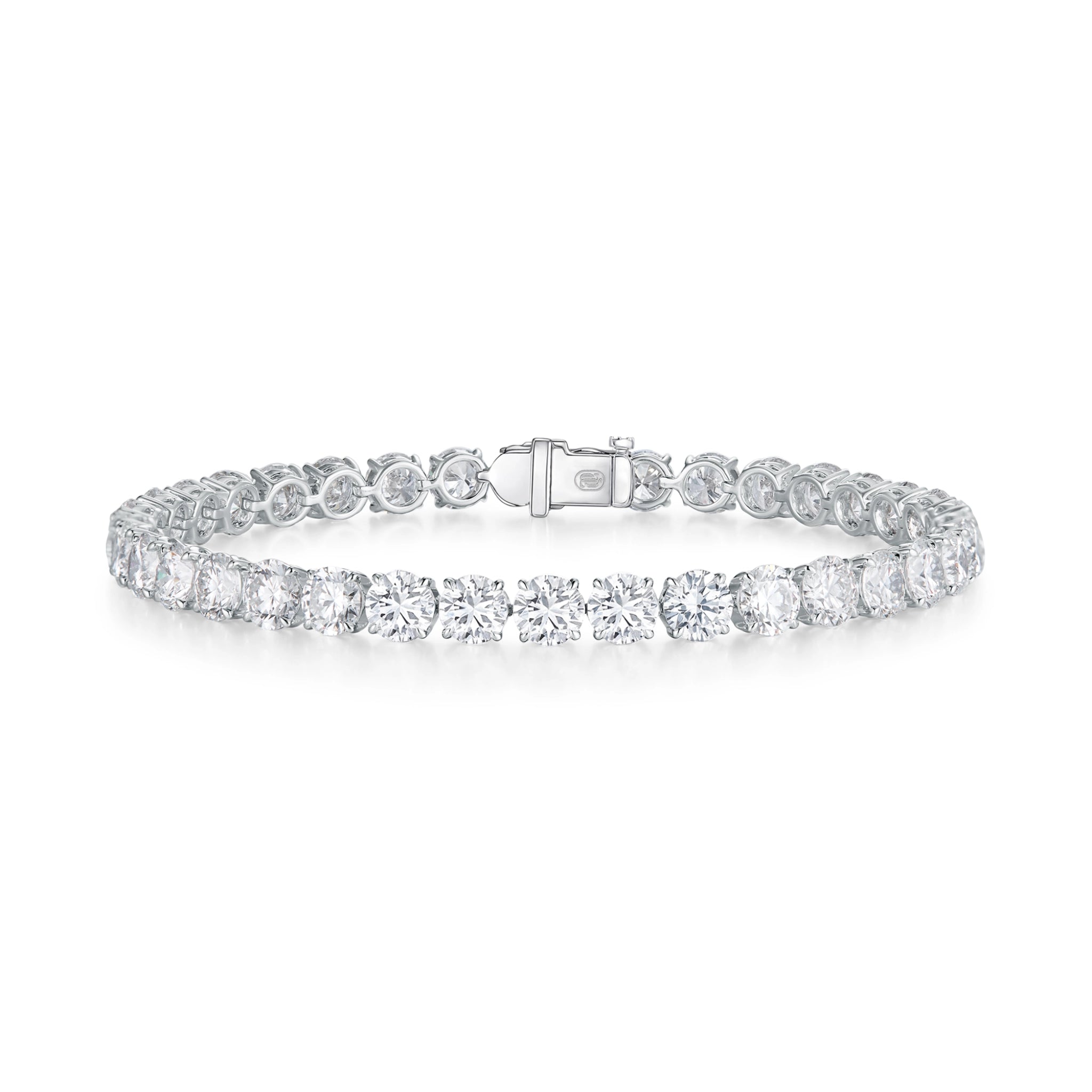 J'ENCHANTE ONE medium diamond tennis bracelet in white gold, featuring a breathtaking continuous sequence of round brilliant diamonds totaling approximately 12.51 carats. Each 0.30-carat stone is architecturally cradled in the signature J-setting to maximize light return, delivering a bold and unforgettable statement presence.