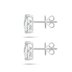 Side profile view of the J'ENCHANTE ONE pear diamond stud earrings, highlighting the signature J-setting and secure earring backs. The refined architectural curve supports and lifts the stone from the side, allowing light to pass through freely to dramatically enhance clarity and brilliance.