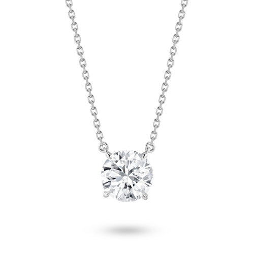 Front view of the J'ENCHANTE ONE round cut diamond solitaire necklace, featuring a breathtaking 3-carat brilliant center stone. The minimalist white gold design allows the diamond to appear floating, catching light with every movement for a timeless expression of elegance.
