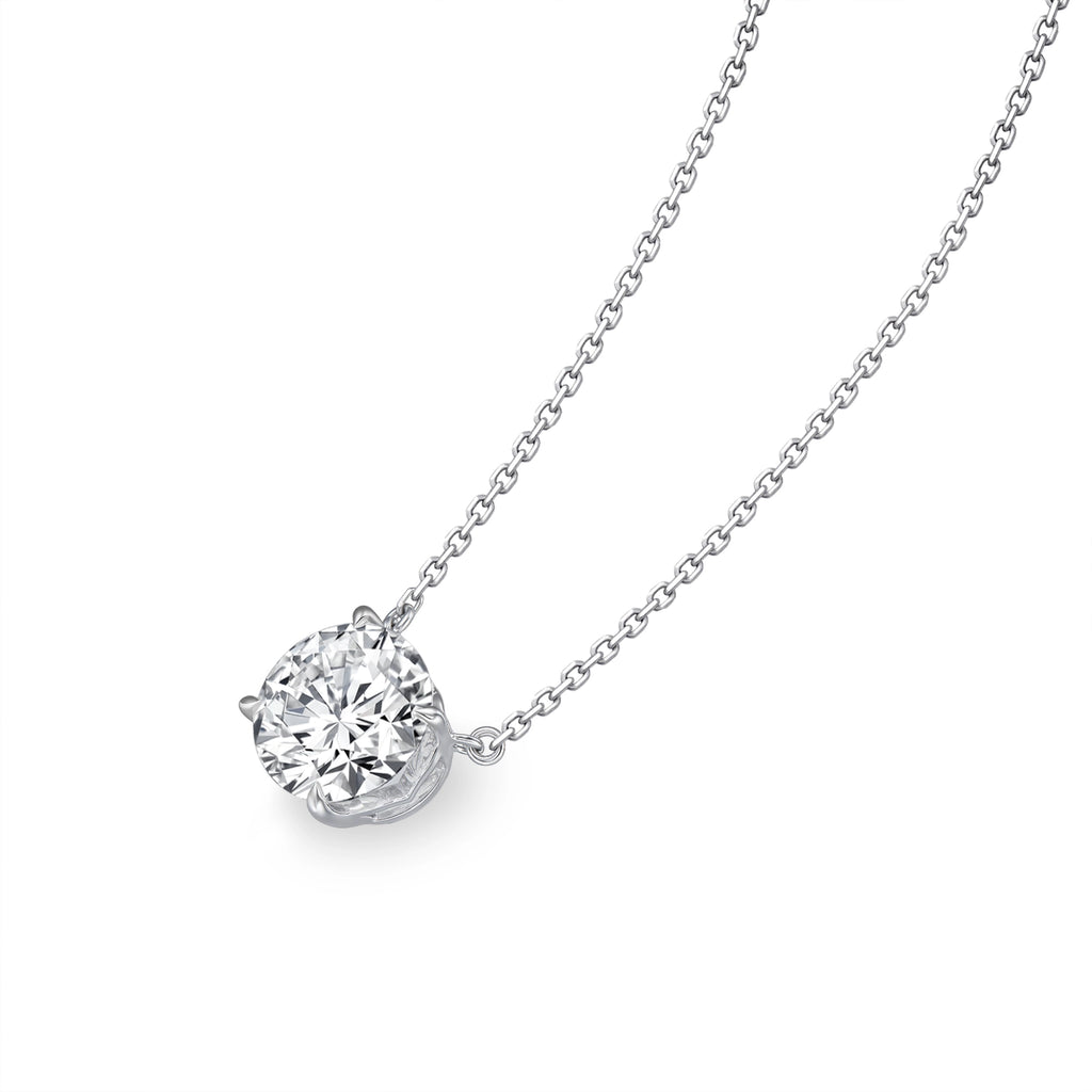 Angled view of the J'ENCHANTE ONE 3-carat round diamond necklace, highlighting the signature J-setting. The graceful architectural curve securely cradles the stone while allowing maximum light to enter from all angles, enhancing its brilliant sparkle.