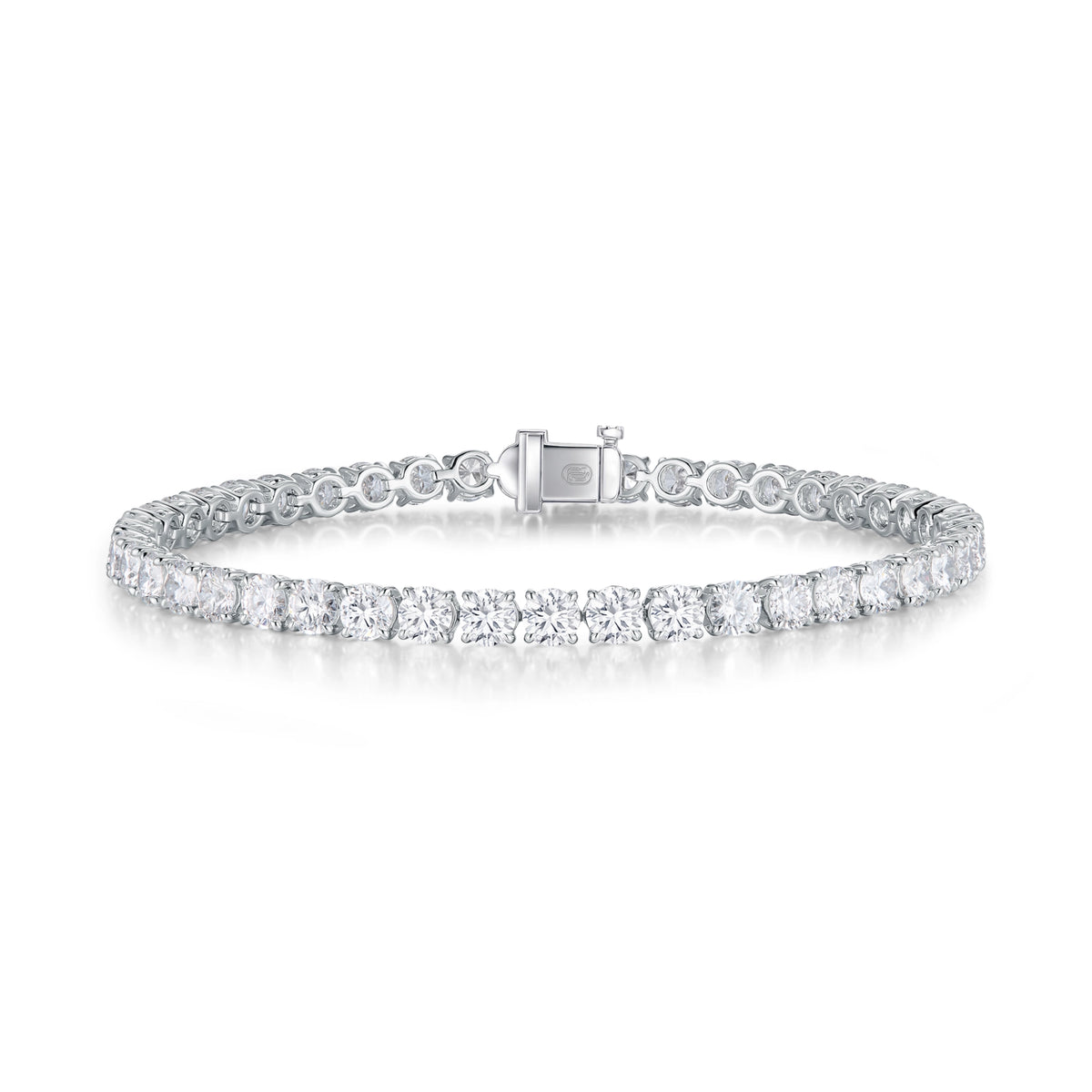 J'ENCHANTE ONE small diamond tennis bracelet in white gold, featuring a seamless, fluid array of round brilliant diamonds totaling approximately 6.85 carats. Each 0.15-carat stone is cradled in the signature J-setting—an elegant architectural arch designed to maximize light return for delicate everyday elegance.