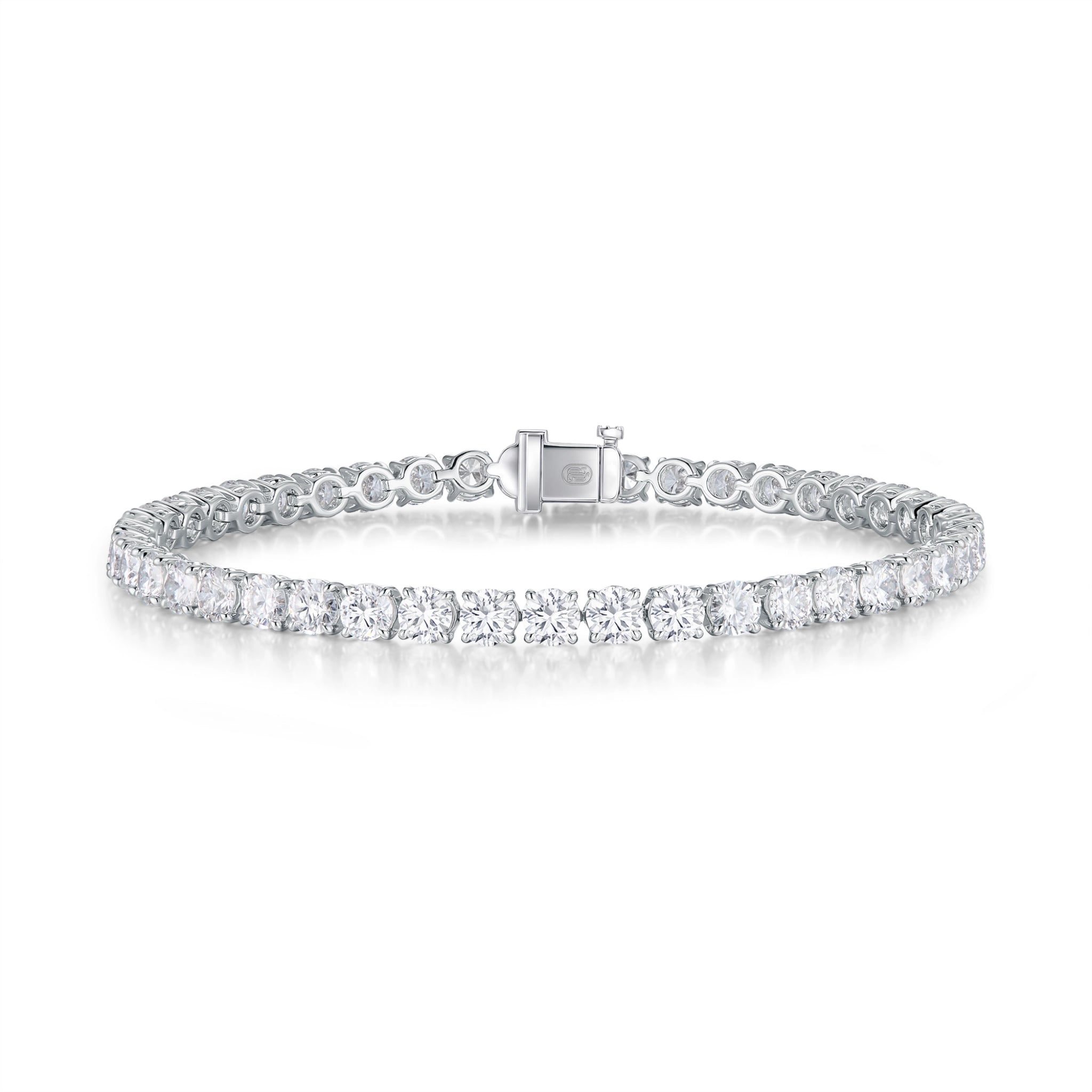 J'ENCHANTE ONE small diamond tennis bracelet in white gold, featuring a seamless, fluid array of round brilliant diamonds totaling approximately 6.85 carats. Each 0.15-carat stone is cradled in the signature J-setting—an elegant architectural arch designed to maximize light return for delicate everyday elegance.