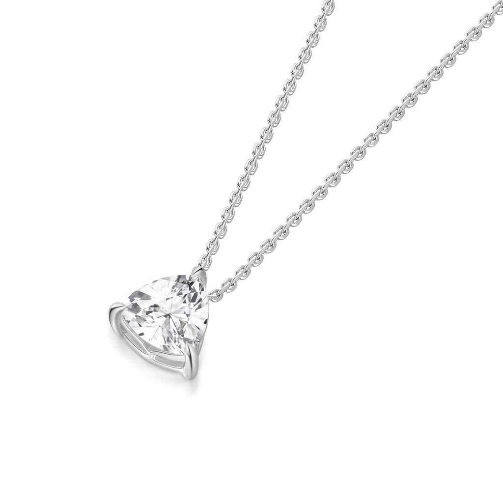 Angled view of the J'ENCHANTE ONE trilliant diamond necklace, showcasing the signature J-setting. The graceful architectural arc cradles and lifts the geometric stone, allowing maximum light to enter from the sides to enhance its clarity and intense brilliance.