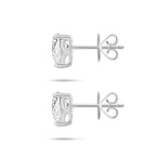 Side profile view of the J'ENCHANTE ONE trilliant diamond stud earrings, highlighting the signature J-setting. The sculpted architectural curve beautifully elevates the stone, allowing maximum side light entry to enhance the depth and brilliance of this unique geometric cut.