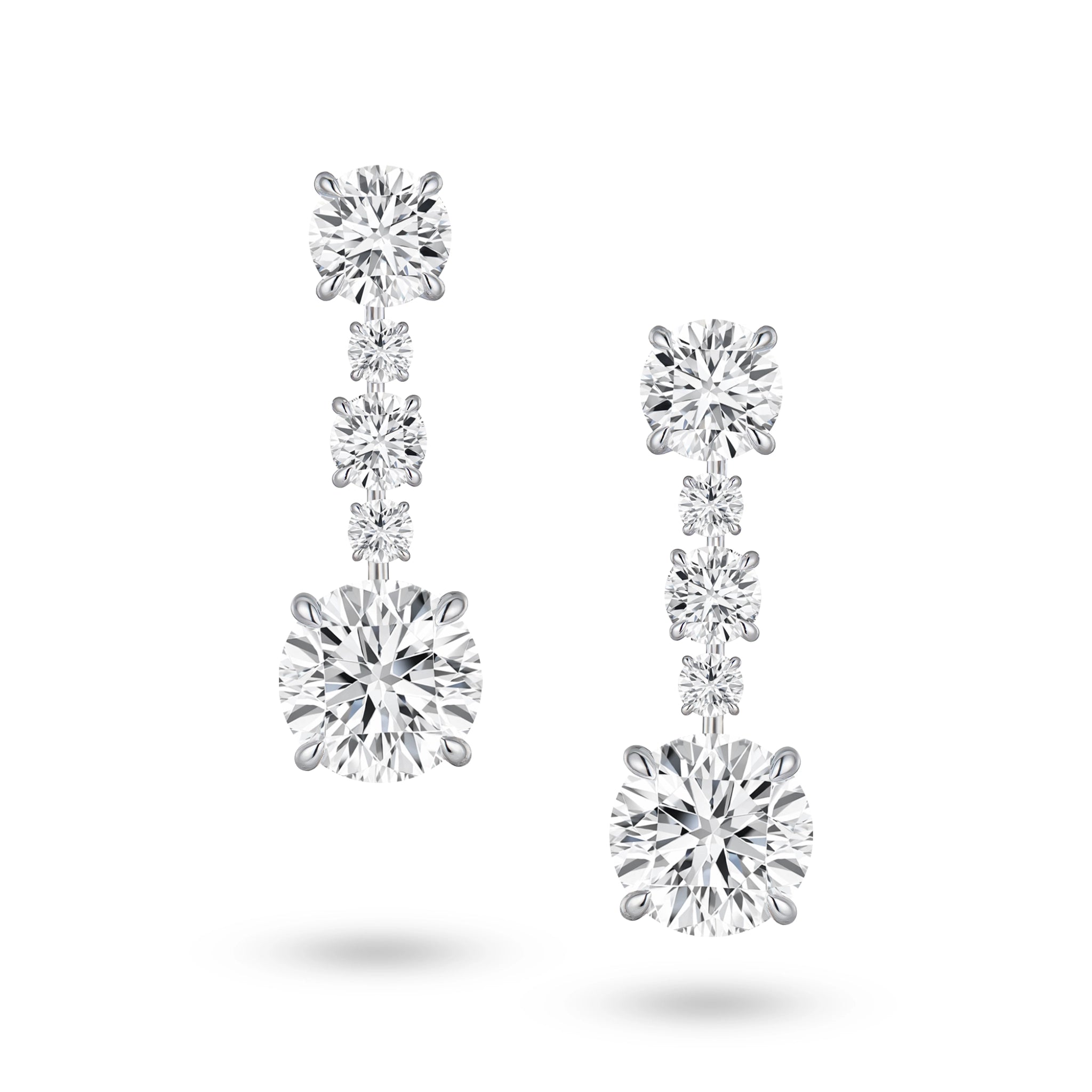 Front view of the J'ENCHANTE The Radiant Line diamond earrings in 18K white gold. Defined by a pure vertical composition, a precise sequence of graduating round brilliant diamonds unfolds into two commanding 3.0-carat bottom anchor stones (10 diamonds totaling approx. 9.08 carats). This flawless alignment creates a continuous, luminous flow of radiance for an elegant and effortless statement.