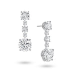 highlighting the refined 18K white gold setting and secure earring posts. This perspective reveals the delicate rhythm and graduating scale of the vertically aligned round diamonds. Meticulously positioned with minimal metal interference, the stones capture light beautifully from every angle to achieve perfect continuity and luminosity.