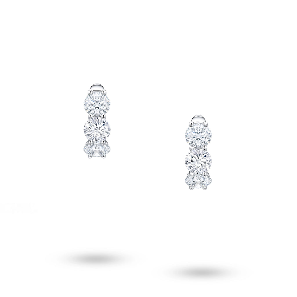 Front view of J'ENCHANTE Radiant Trio earrings with graduated round lab-grown diamonds set in 18K white gold.