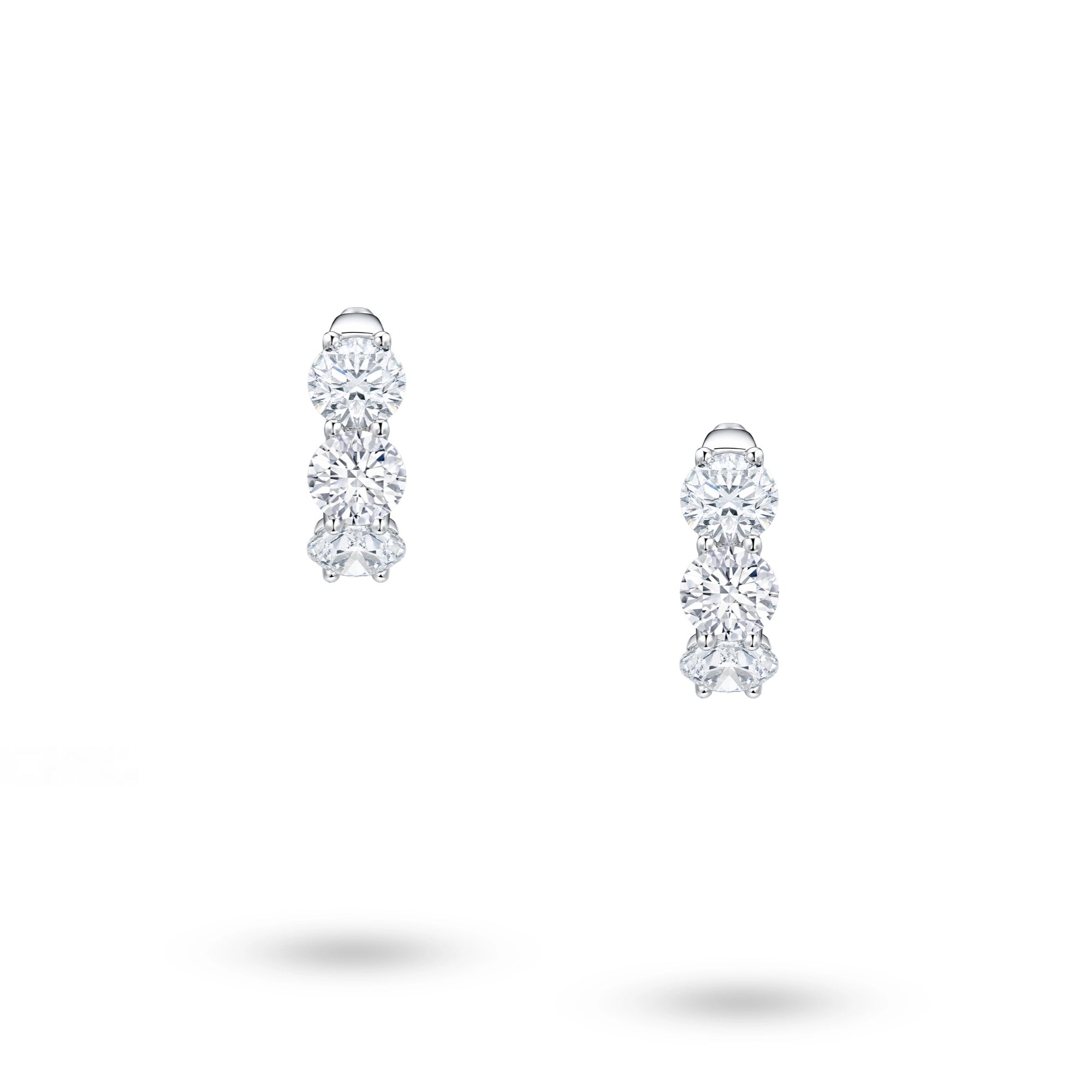 Front view of J'ENCHANTE Radiant Trio earrings with graduated round lab-grown diamonds set in 18K white gold.